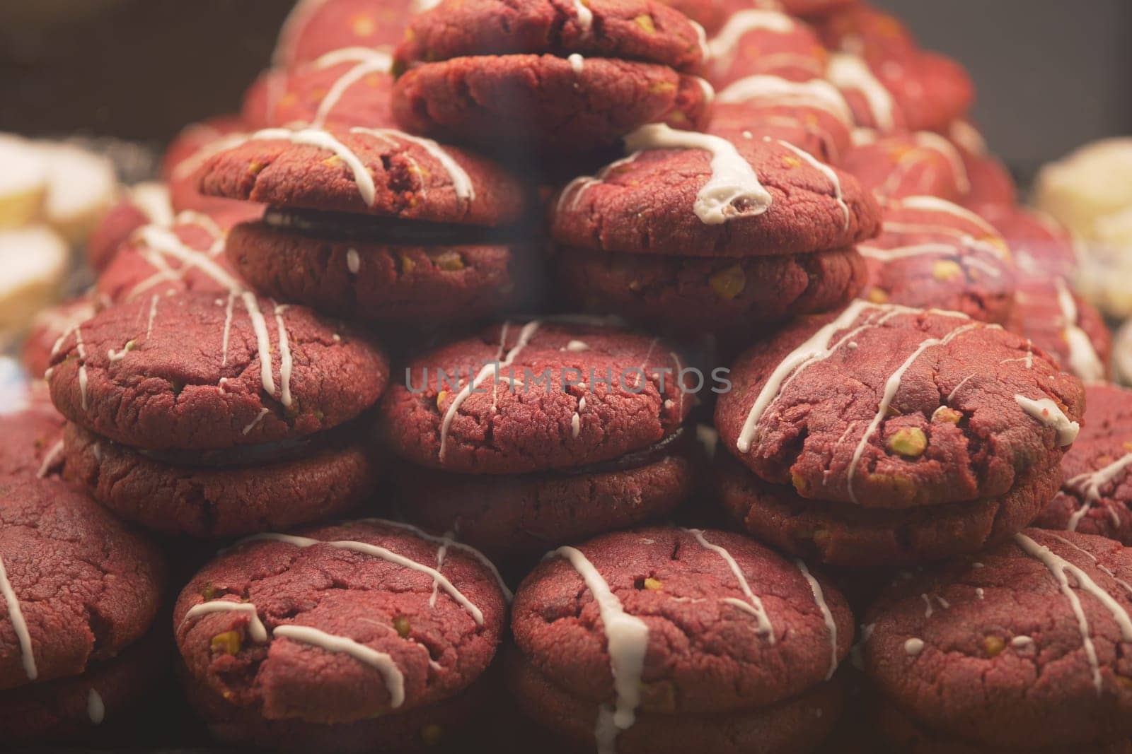Delicious red velvet cookies are neatly arranged in a display.