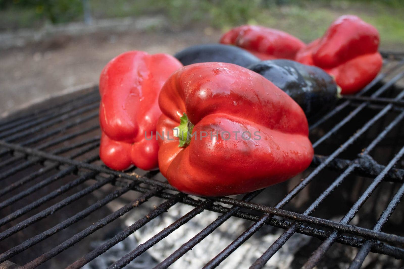 Roasted red pepper and eggplant to make the typical Catalan dish Escalivada cooked on the barbecue
