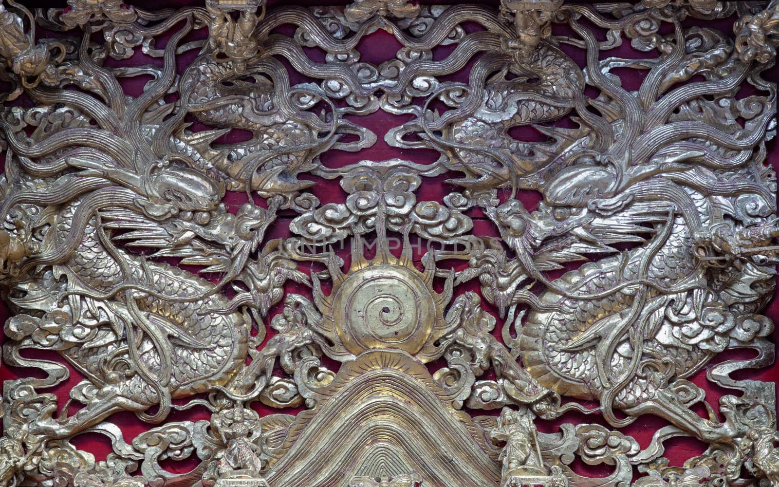 Samut Prakan, Thailand - Jan 11, 2025 - Elaborate sculptures on ceiling design inside the Buddhist temple of Wat Dhammakatanyu (Xian Lo Dai Tien Gong). Taiwanese art style, Look up, use it as your Wallpaper, Poster and Space for text, Selective focus.