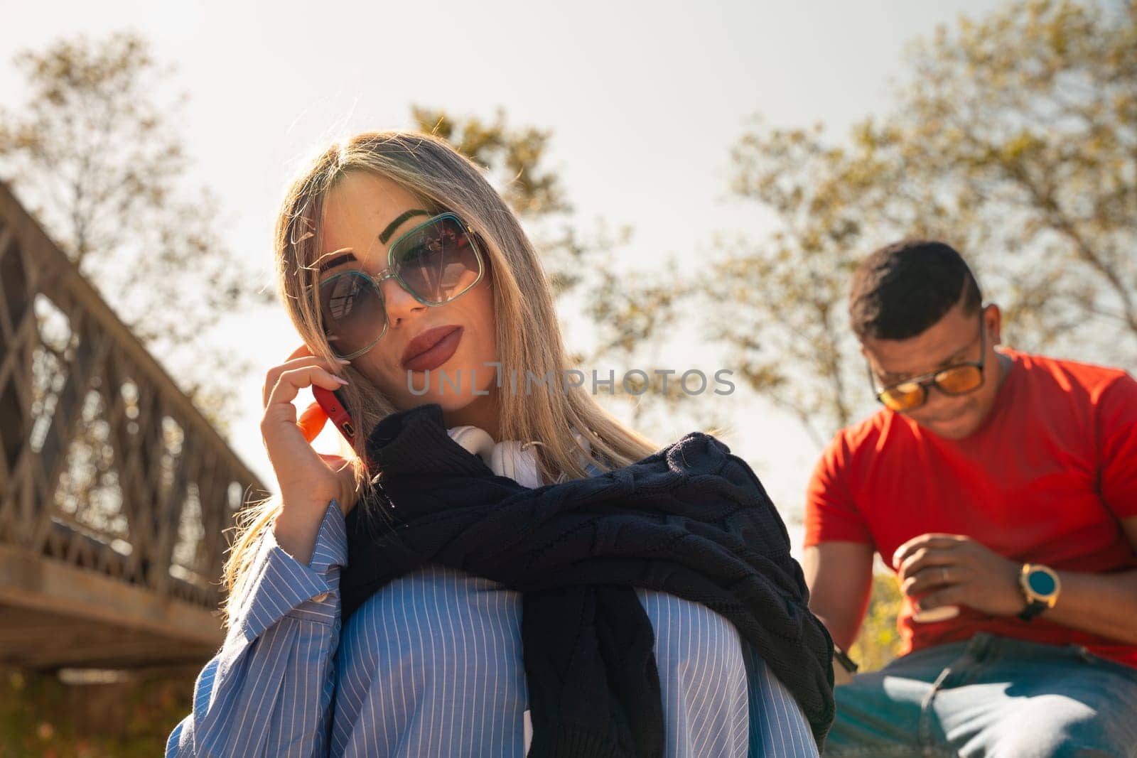 Portrait Happy young Woman With Perfect White Teeth Smiling On telephone.