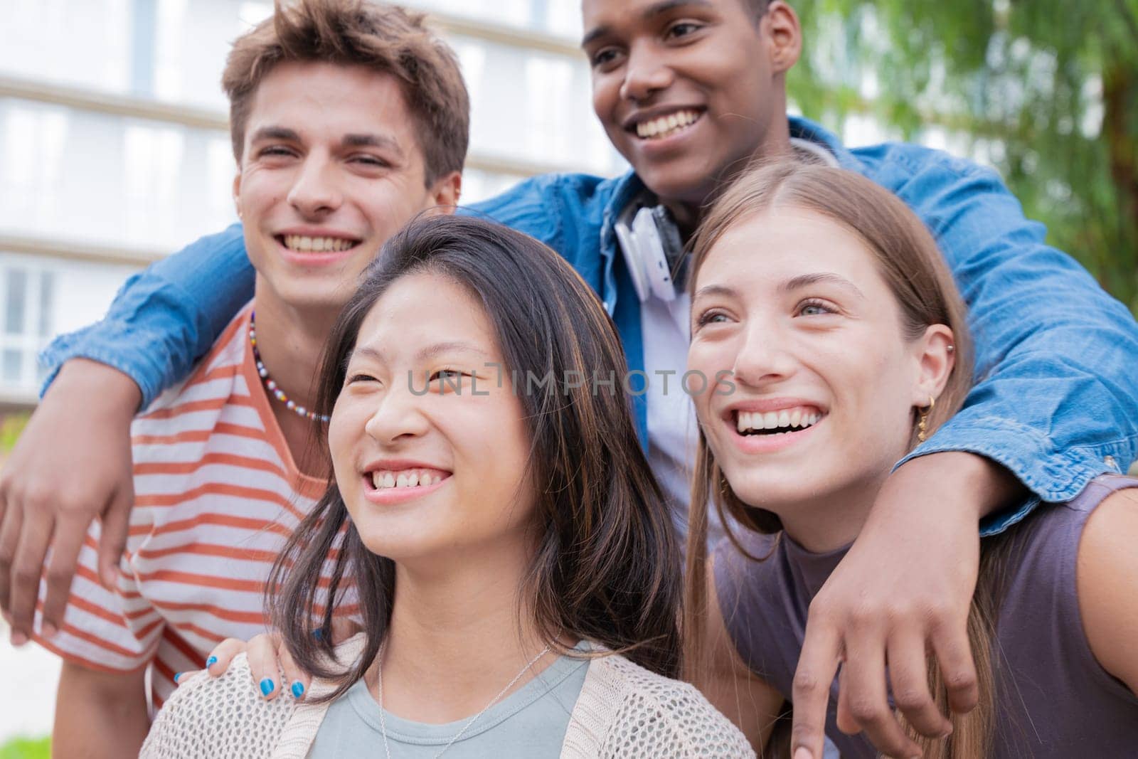 group of friends taking a selfie together and laughing together at the university.Technology or networking, connectivity and happy college people take a photo smiling for social media