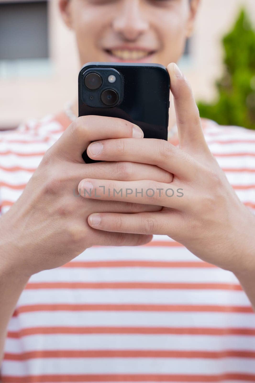 man hands typing on phone browsing mobile phone on social media