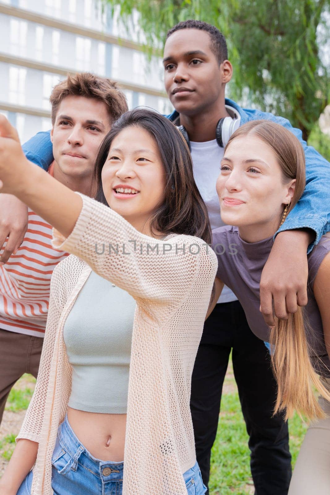 group of friends taking a selfie together and laughing together at the university.Technology or networking, connectivity and happy college people take a photo smiling for social media