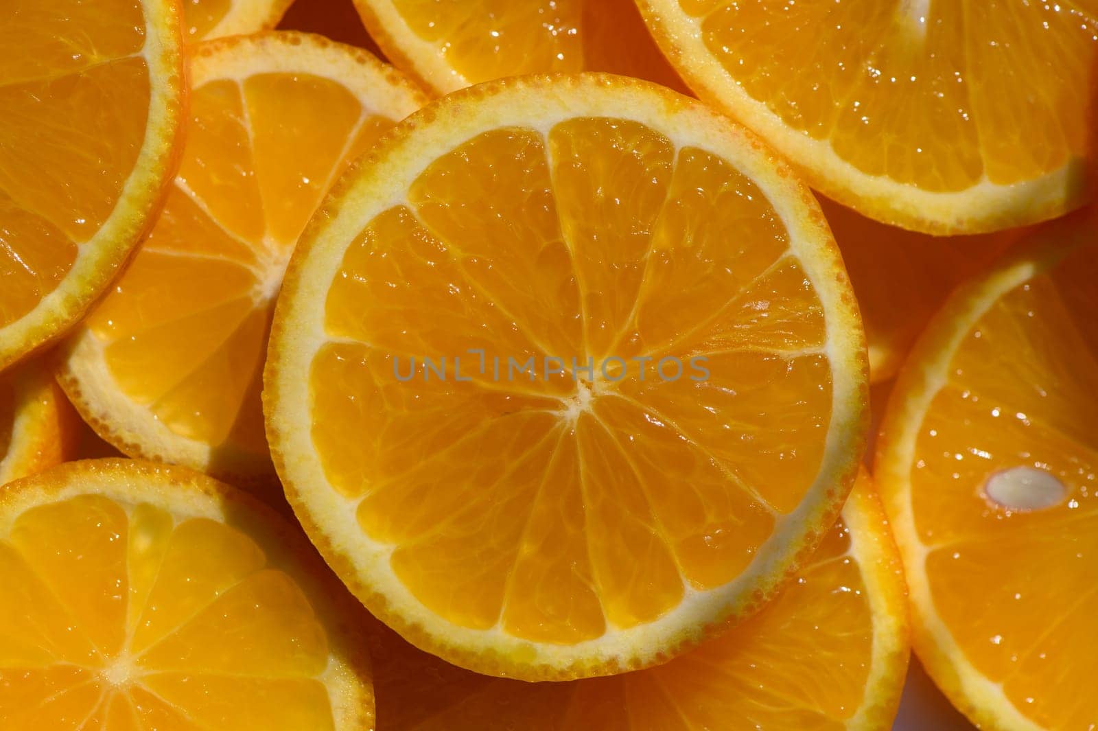 Juicy orange slices fill the space, showcasing their rich color and fresh appeal, perfect for a bright summer dish.