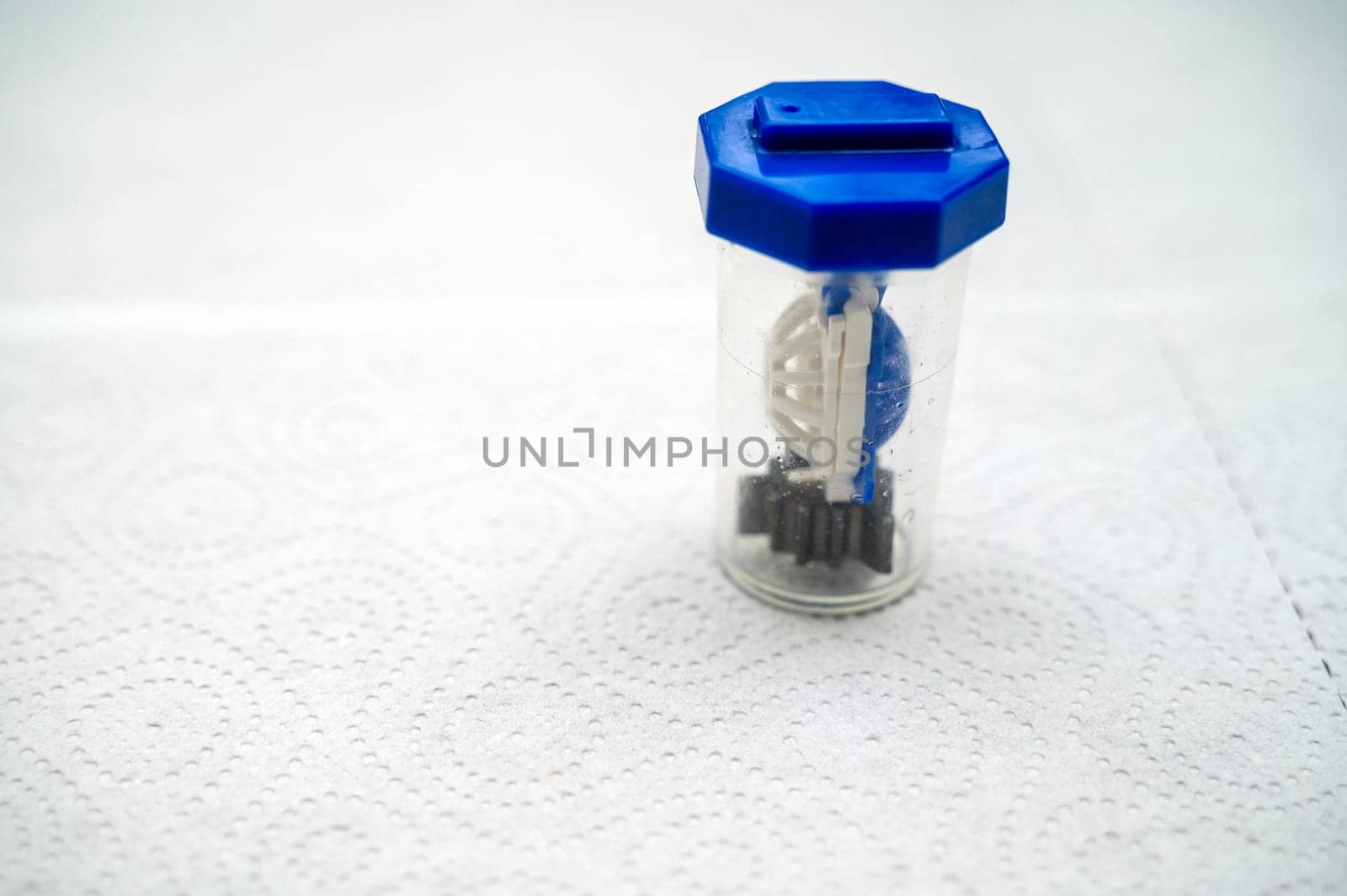 close-up of a container for cleaning and storing contact lenses for eyes, used at home. For soft and hard lenses.