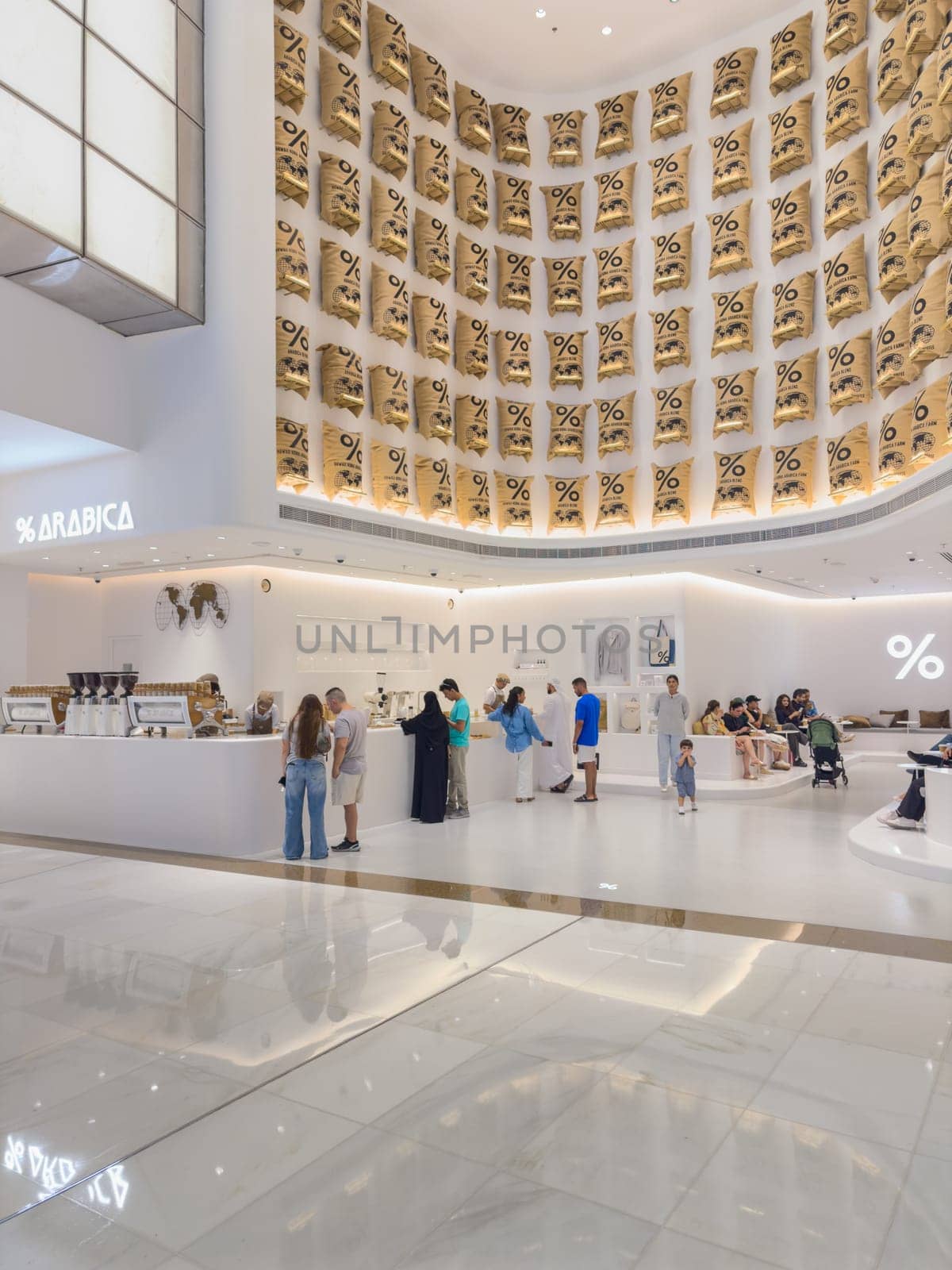 UAE, Dubai, 24 September 2024: the interiors of the largest shopping mall in the world, Dubai Mall, the storefronts of branded stores and visitors to the famous mall. High quality photo