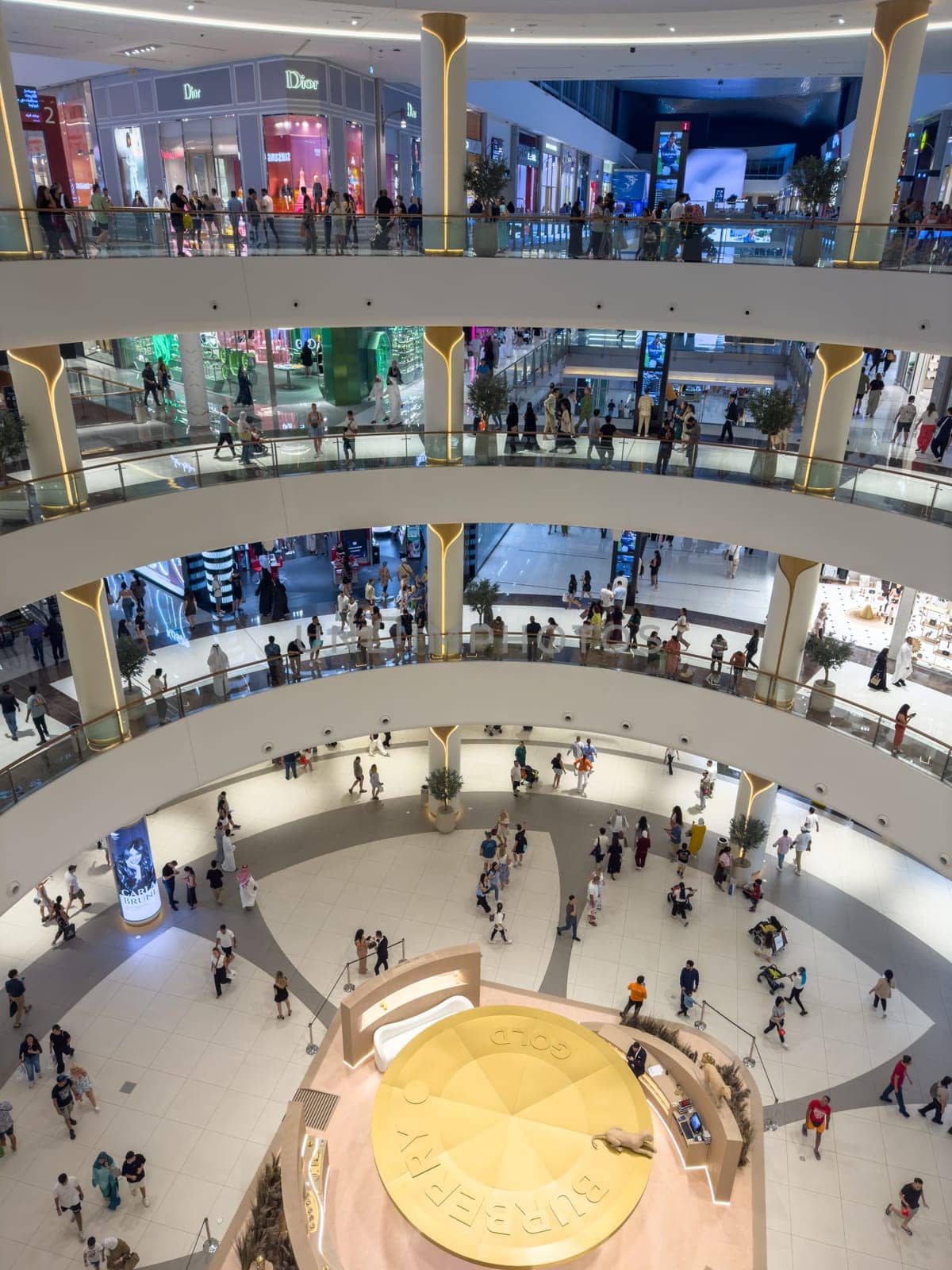 UAE, Dubai, 26 September 2024: the interiors of the largest shopping mall in the world, Dubai Mall, the storefronts of branded stores and visitors to the famous mall. High quality photo