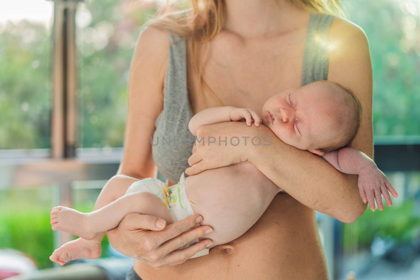 A mother lovingly embraces her newborn baby, holding them close to her chest. A tender moment of warmth, security, and deep maternal love, symbolizing bonding, comfort, and the unbreakable connection between mother and child.