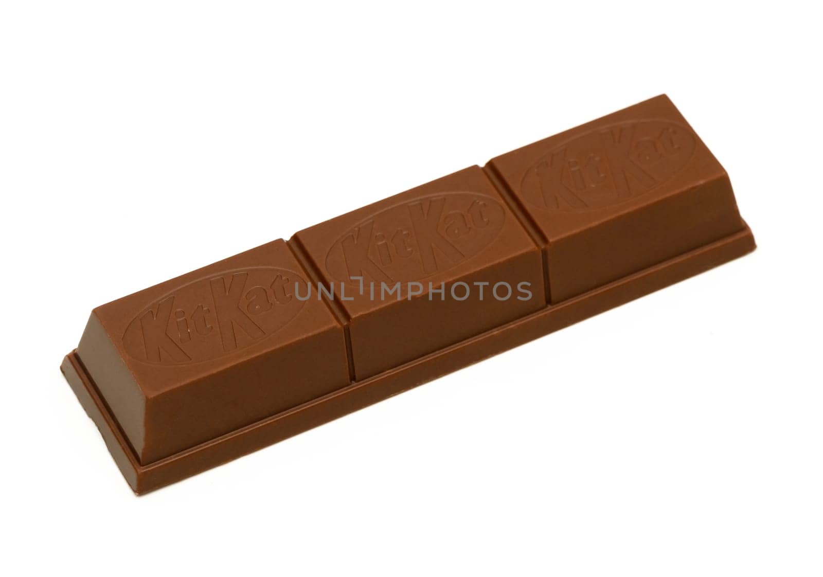 Gaziveren Cyprus -10.02.2025 Three-piece chocolate bar glistens invitingly, evoking cravings for a sweet moment of indulgence.