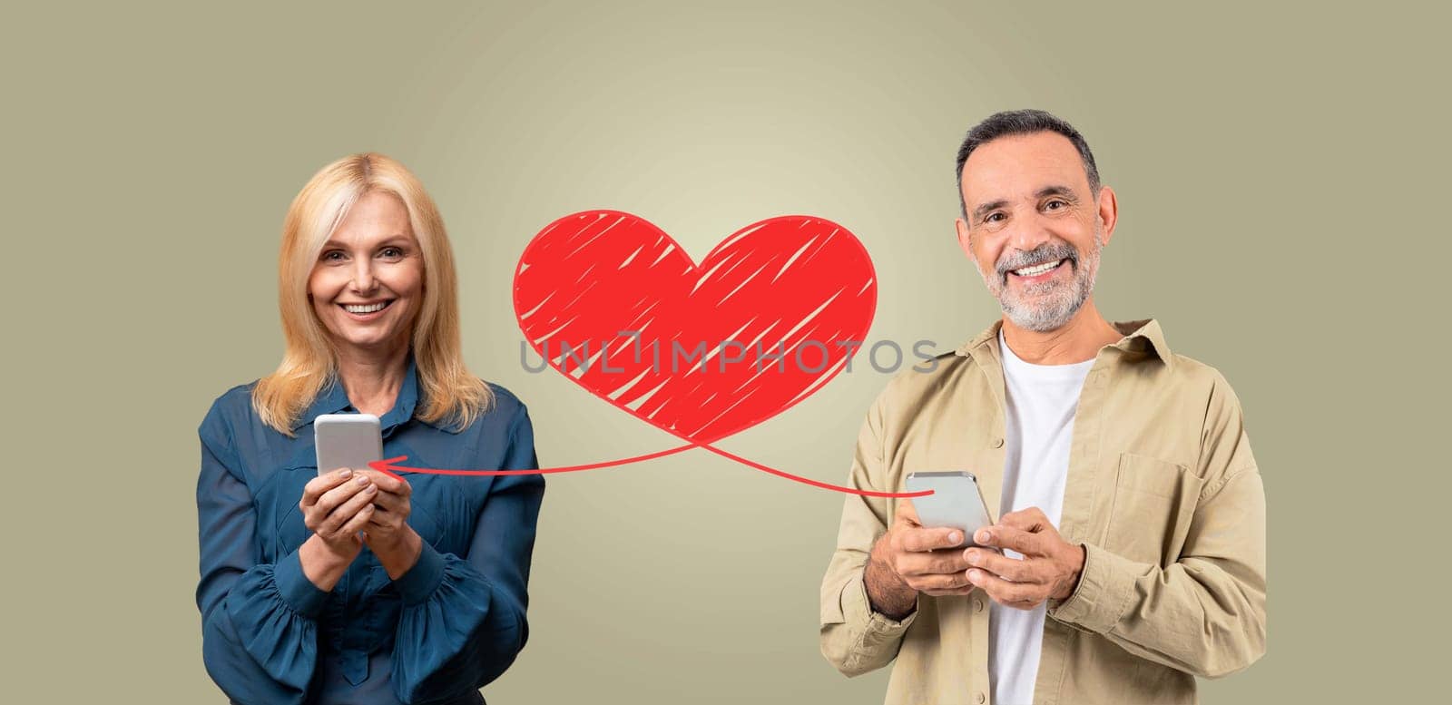 A couple stands together, smiling and holding smartphones, celebrating their affection on St. Valentines Day. They are connected by a drawn heart, symbolizing love and communication in a digital age.