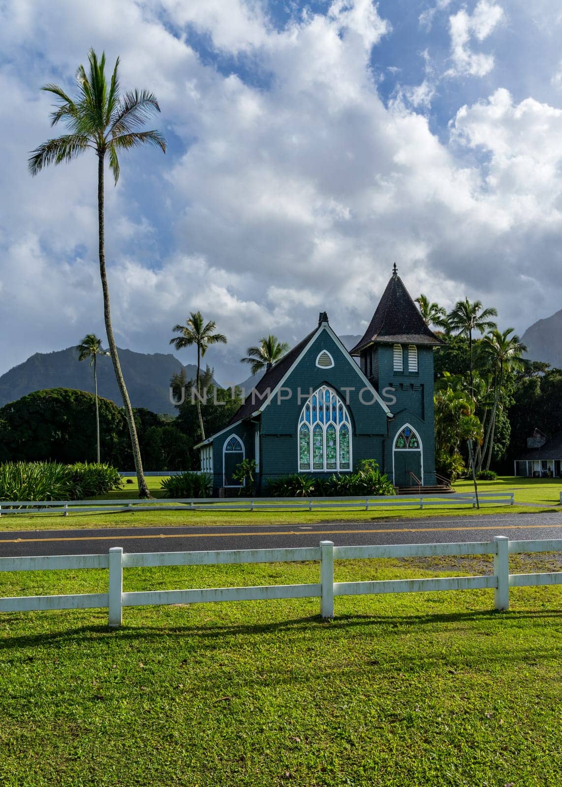 The Waioli Huiia Church stands in Hanalei, Kauai, with the majestic mountains in the background, after a heavy storm over the hills