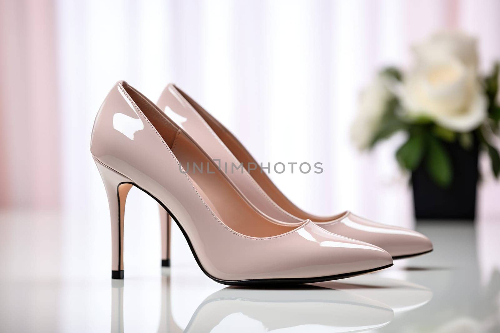 Elegant women's shoes made of light leather with a bouquet of roses on a mirror surface. Women's wedding shoes, side view. by Vovmar