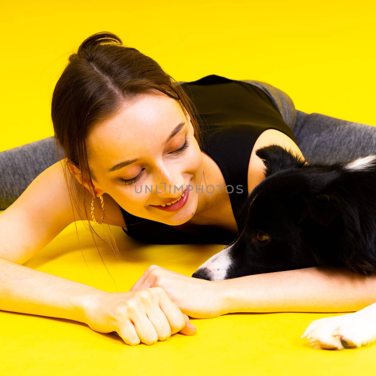 Friendship between people and animals, a studio shot, love, tender, warm feeling and emotion