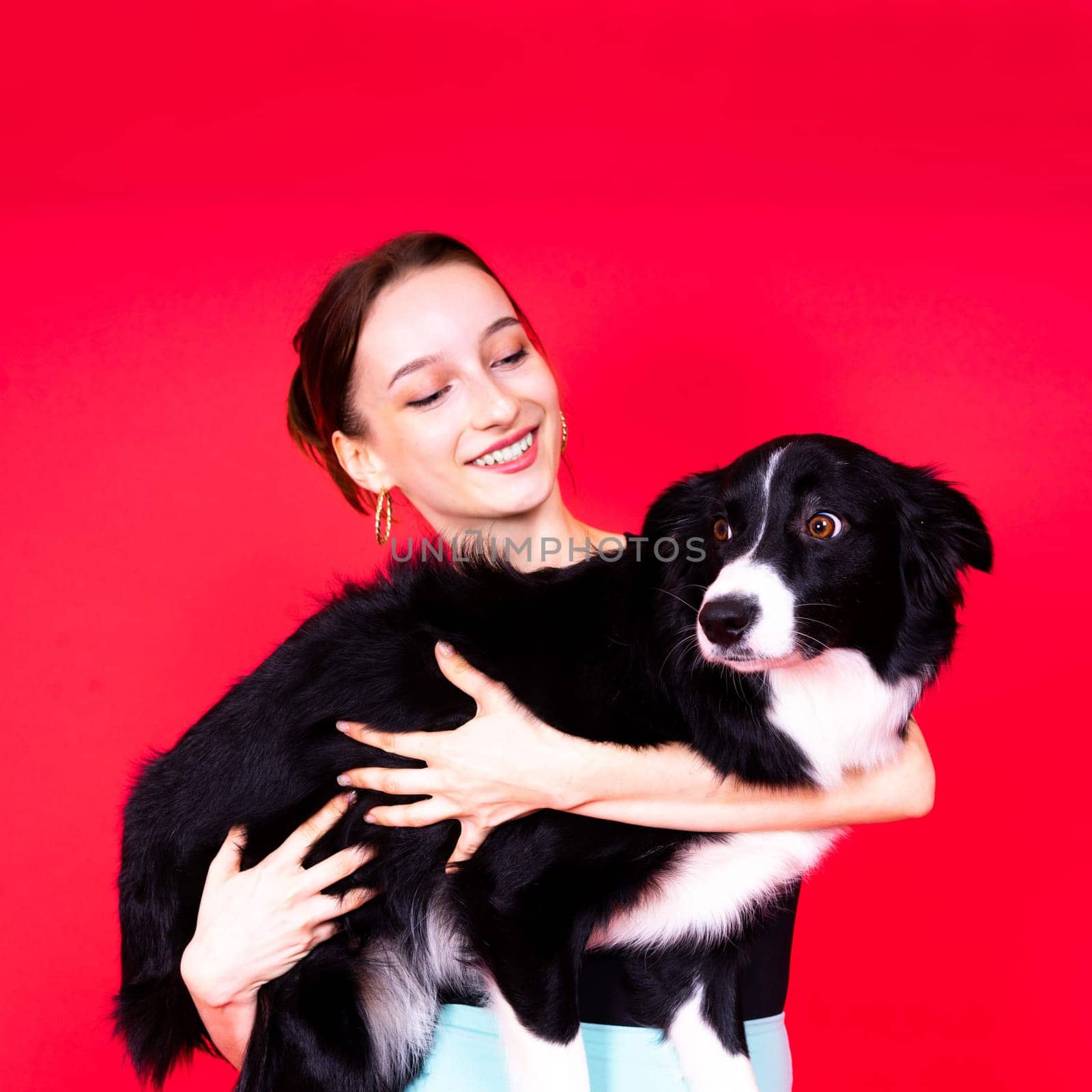 Friendship between people and animals, studio shot, love, tender, warm feeling and emotion by Zelenin