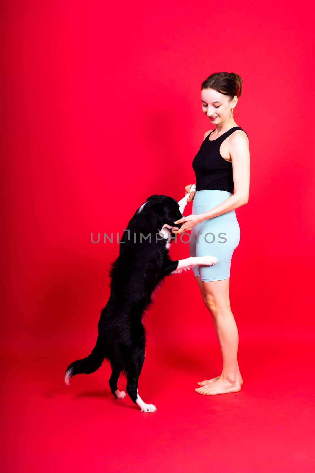 Friendship between people and animals, studio shot, love, tender, warm feeling and emotion by Zelenin