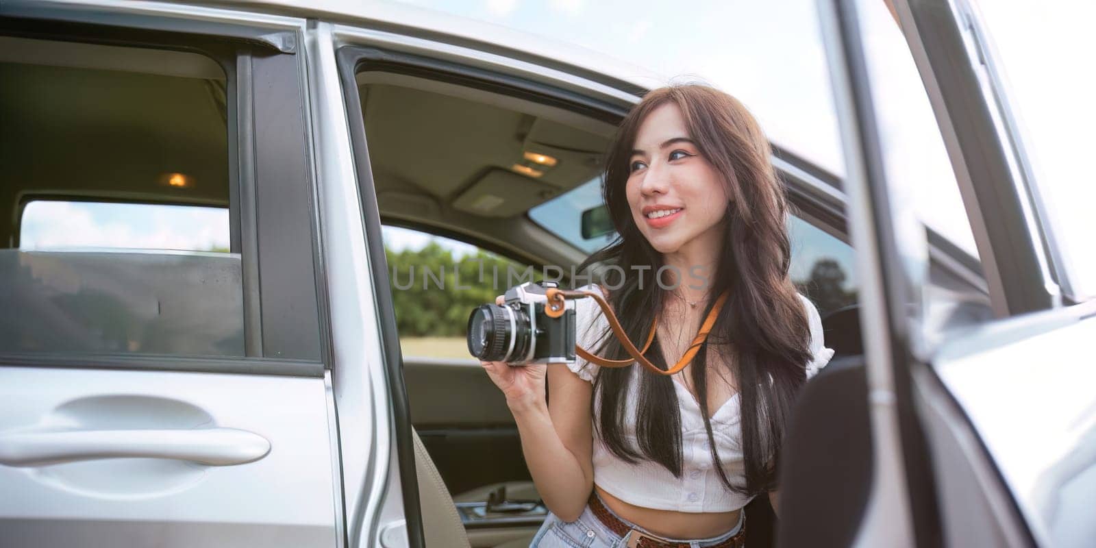 Woman enjoying autumn mountain road trip. concept travelling drive rest.