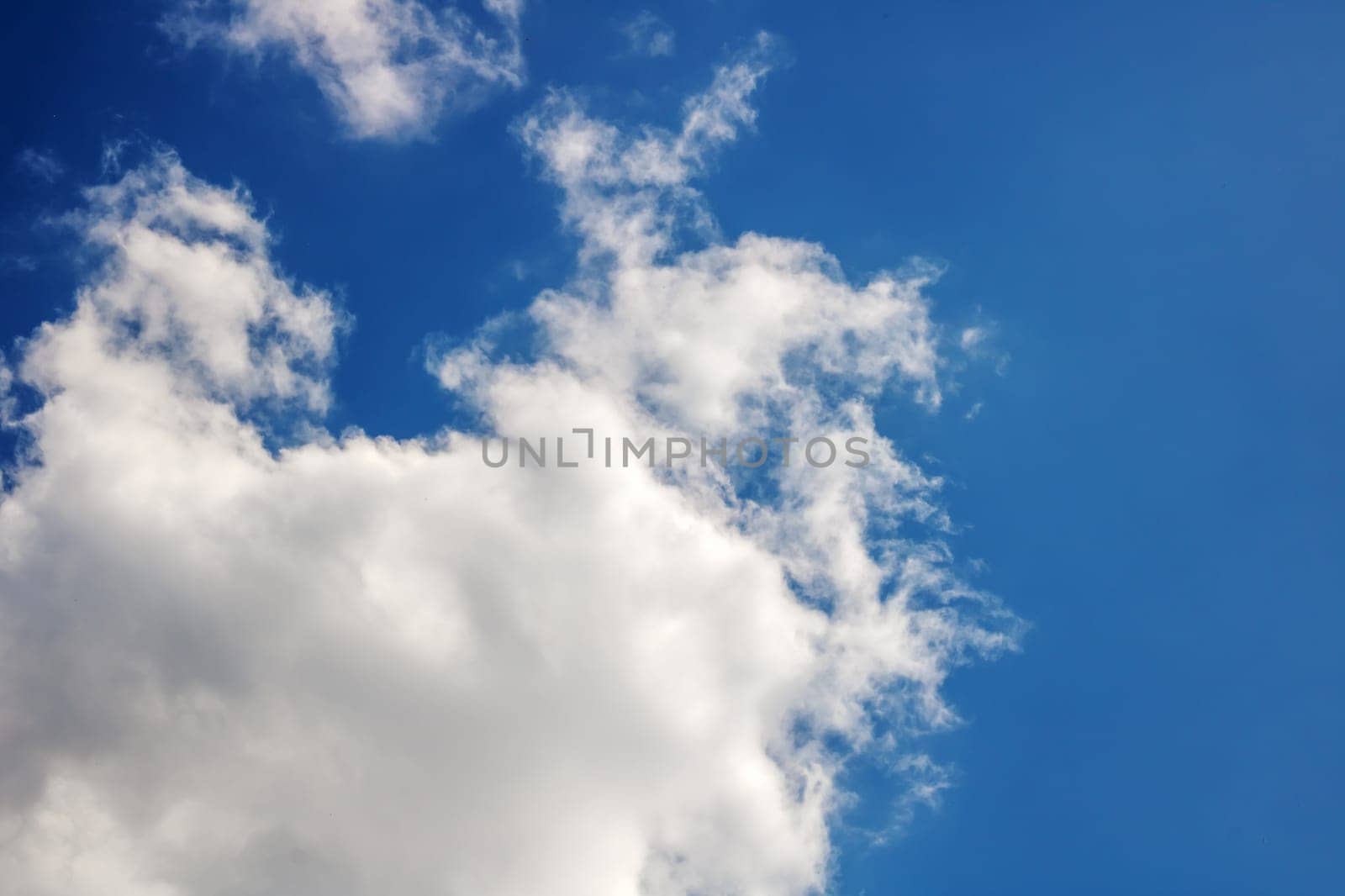 White clouds in a blue bright sky close up