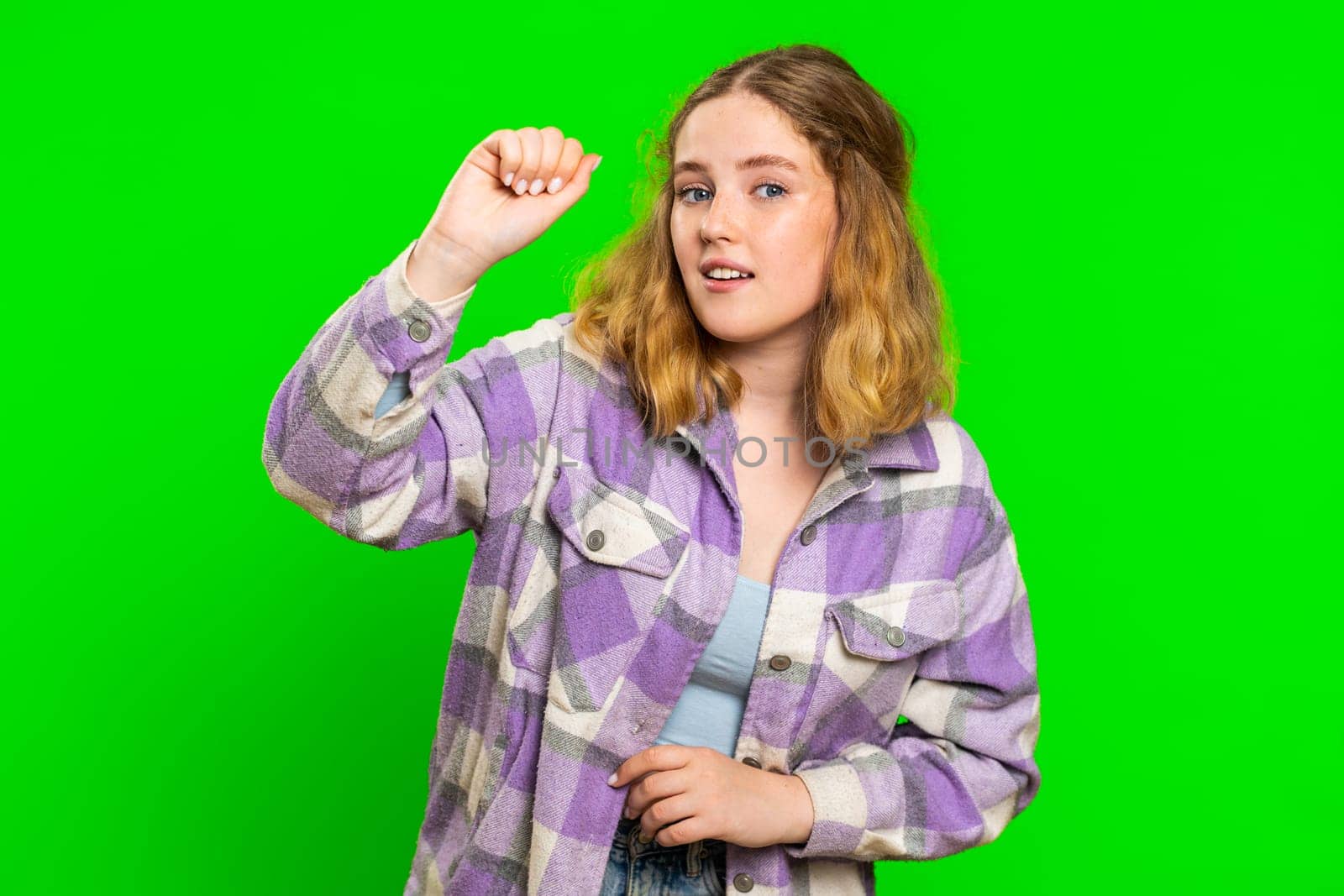 Knock-knock who is there. Confused excited young woman knocking door gesture asking who is at home, feeling embarrassed, no idea, being clueless and uncertain. Girl isolated on chroma key background