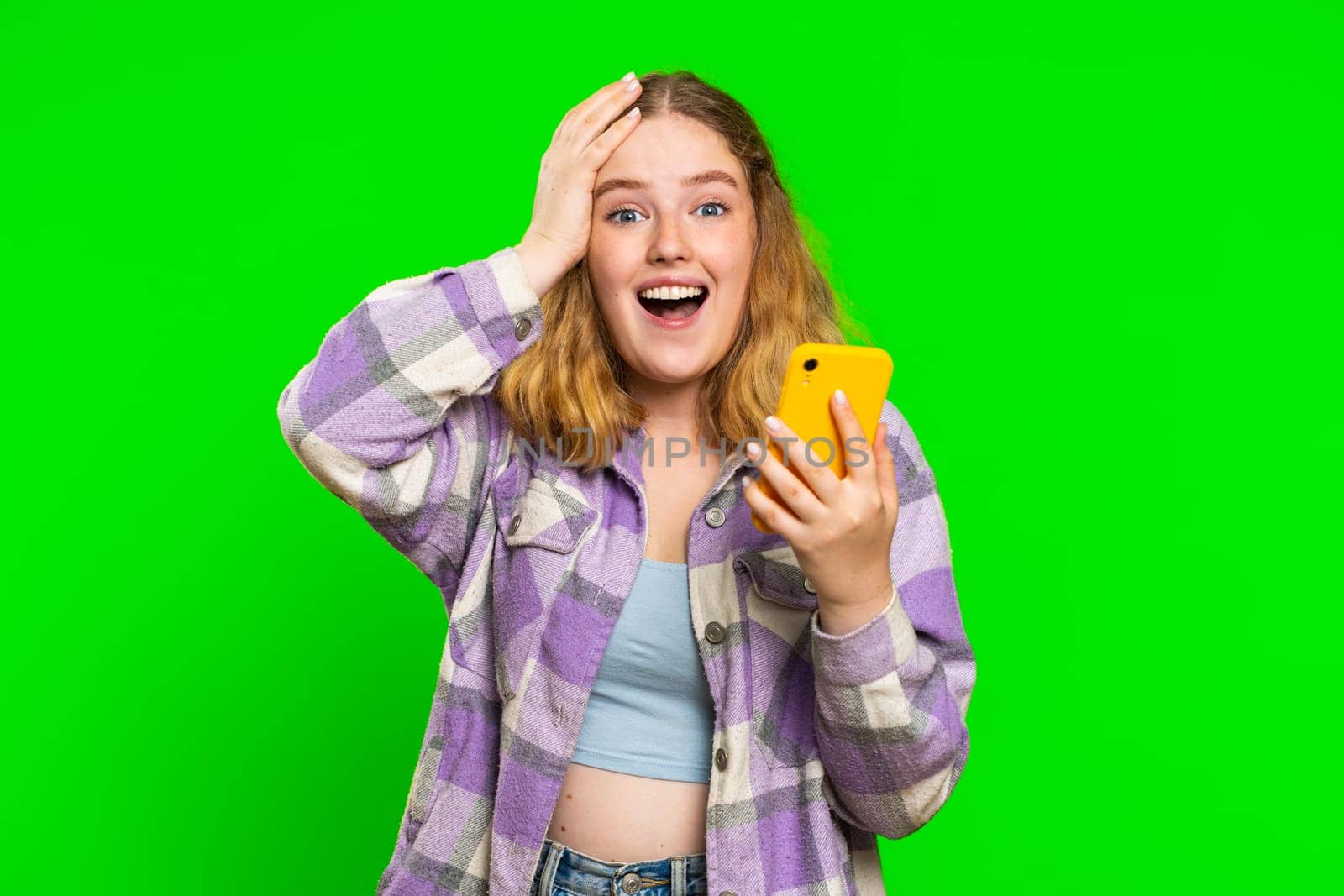Happy excited woman girl use smartphone typing browsing shouting say wow yes found out great big win good news lottery goal achievemen celebrating success, winning play game on chroma key background