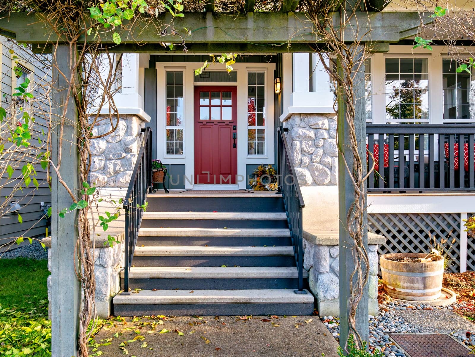 A perfect neighbourhood. Porch and entrance of a nice residential house.