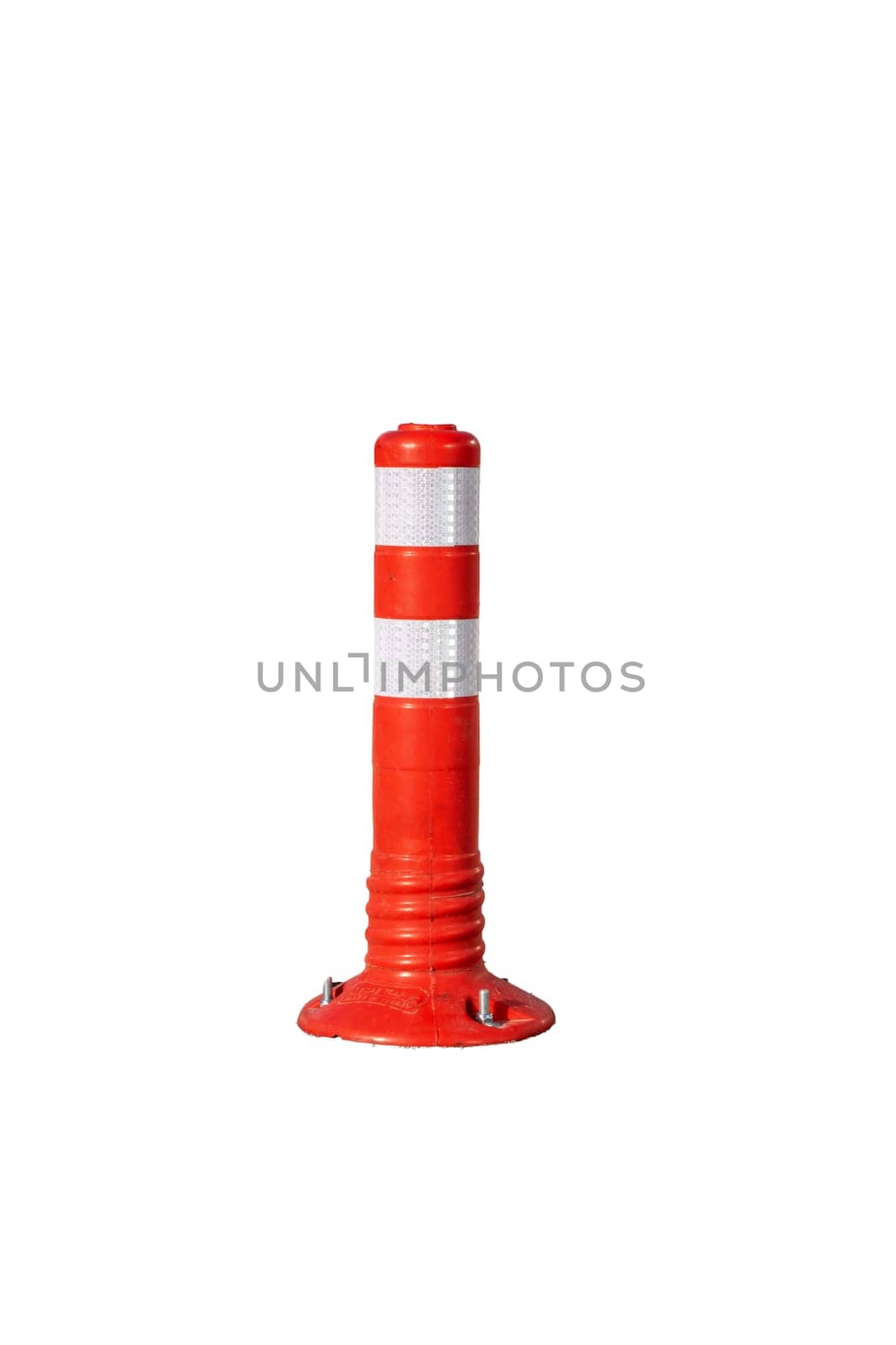 Orange restrictive poles on the road close up