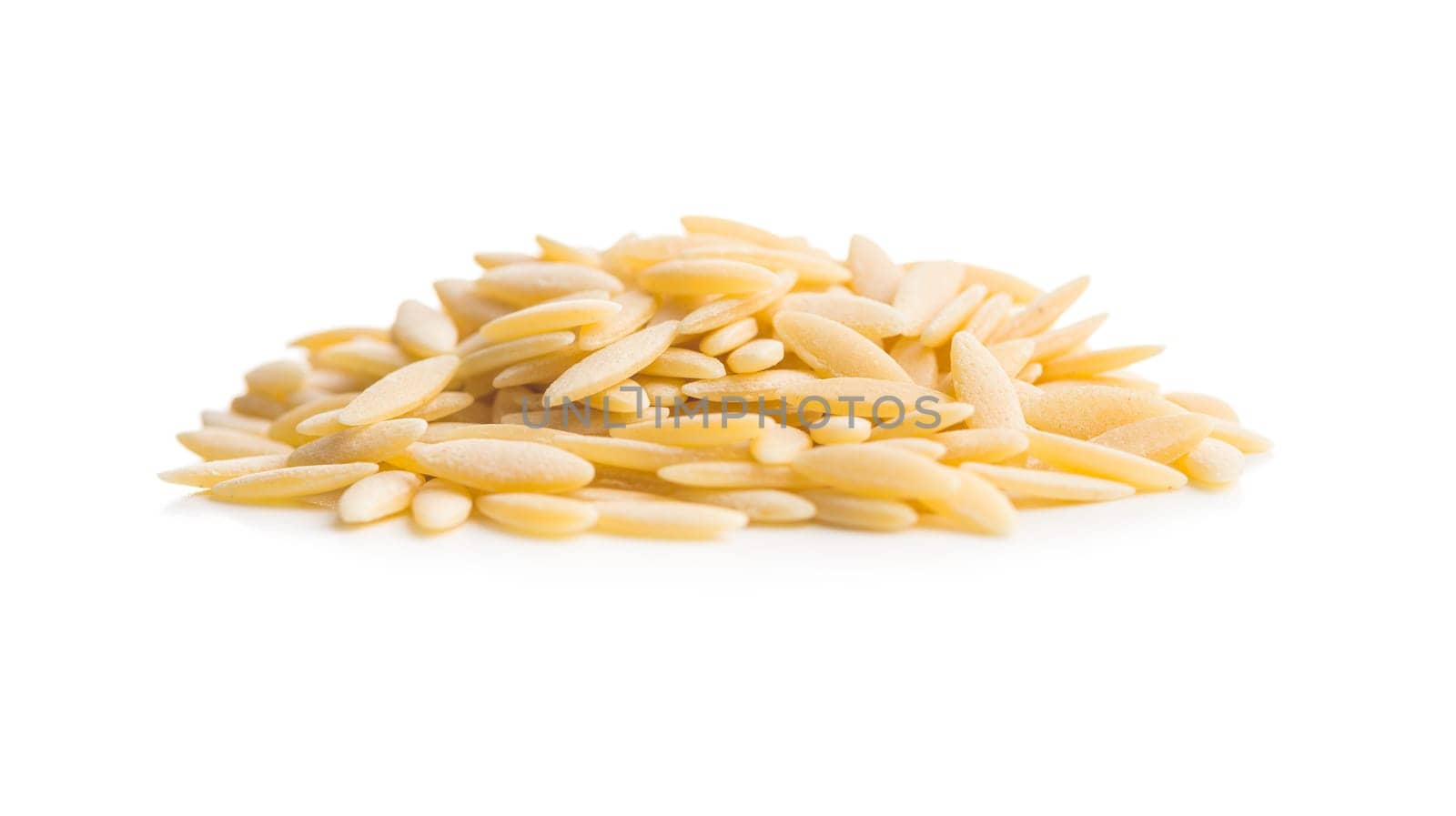 Orzo, kritharaki, risoni pasta. Uncooked dry pasta isolated on a white background.