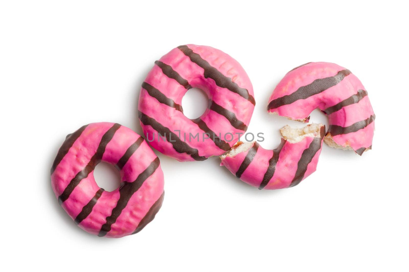 Sweet pink donut with chocolate strips isolated on a white background.
