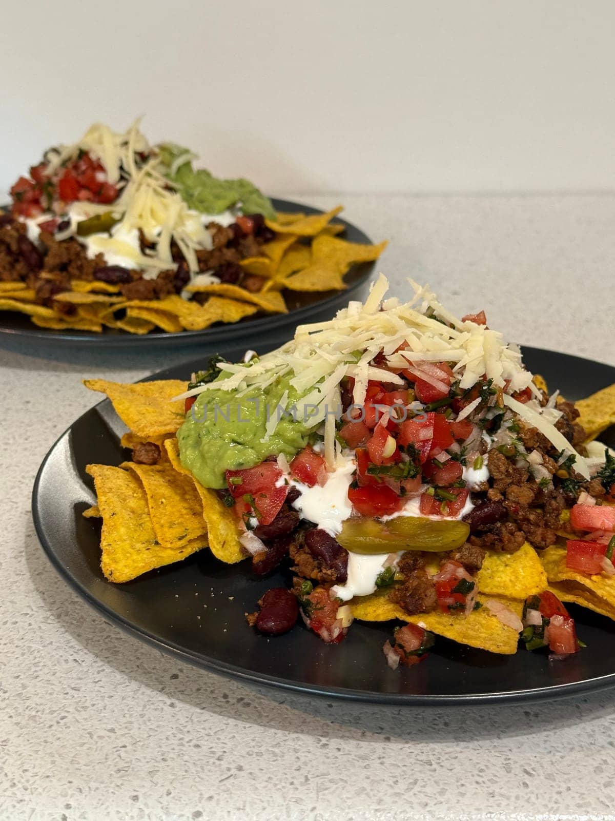 Beef nachos with multiple toppings. High quality photo