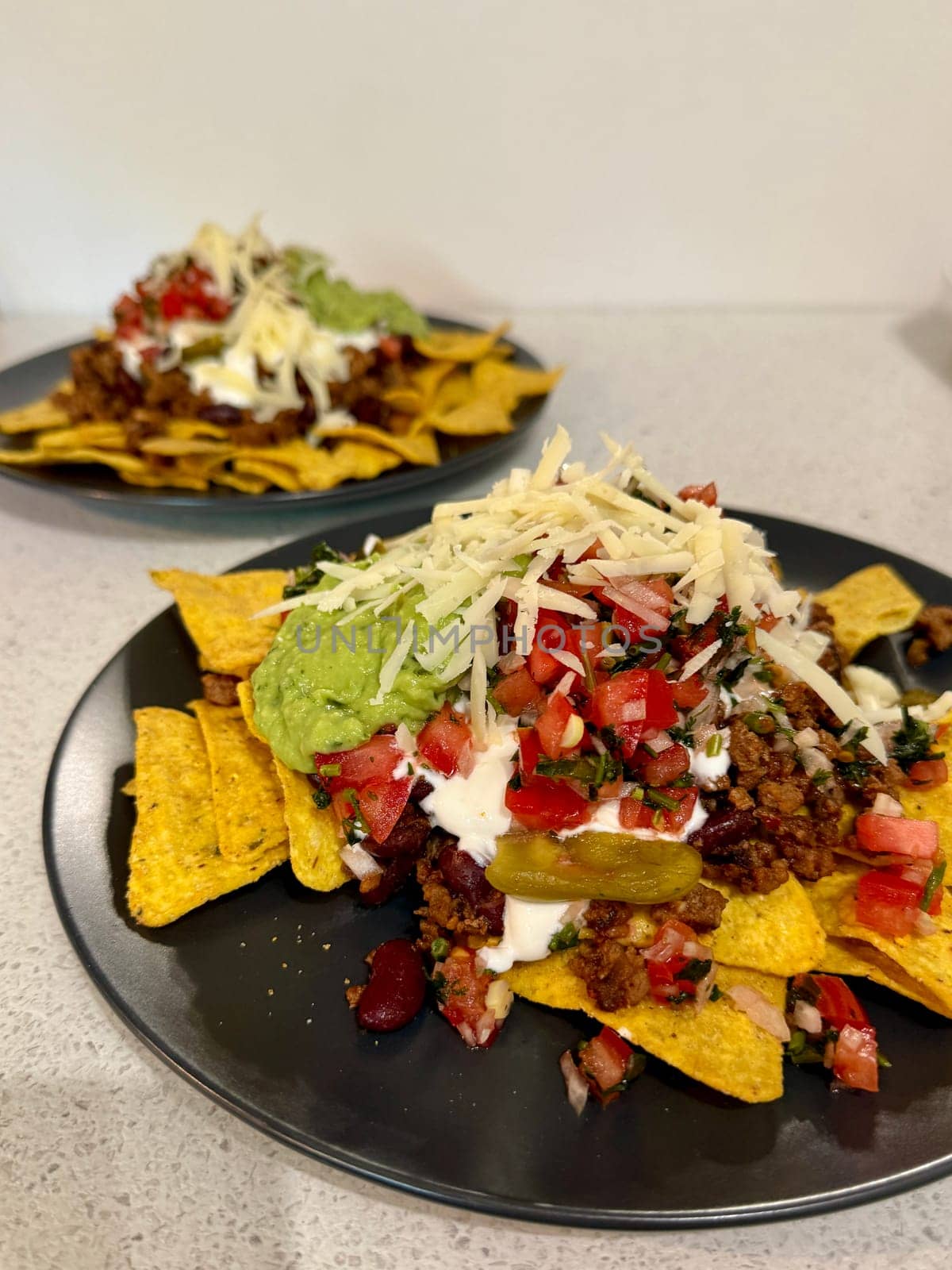Beef nachos with multiple toppings. High quality photo