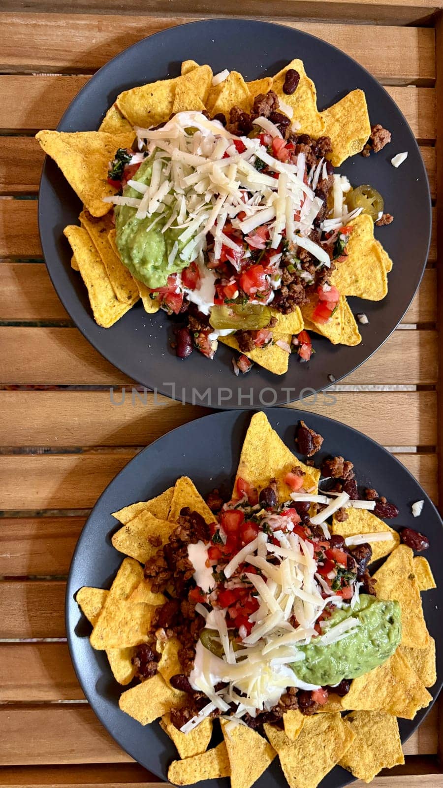 Beef nachos with multiple toppings. High quality photo