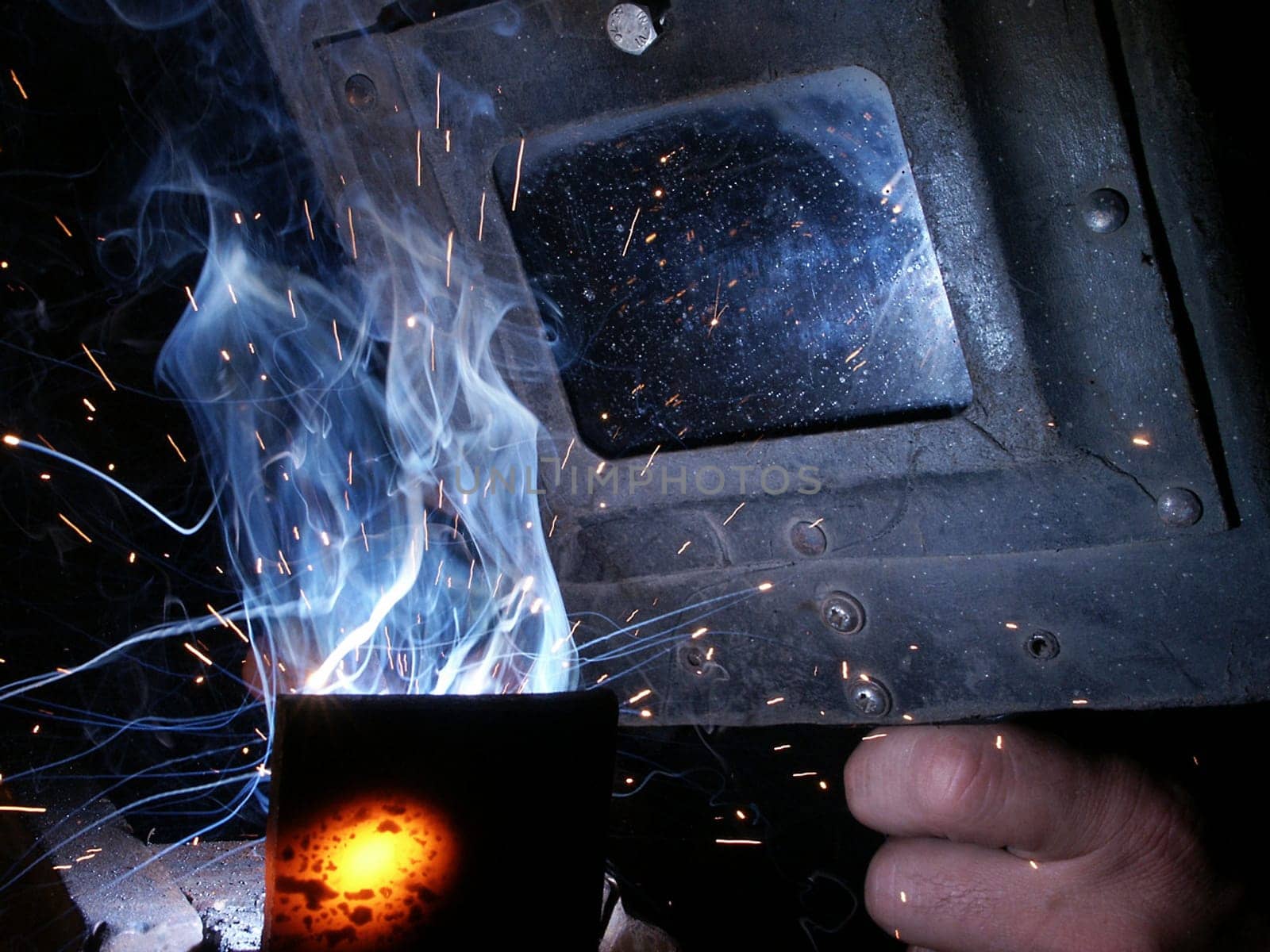 Electric welder at work
