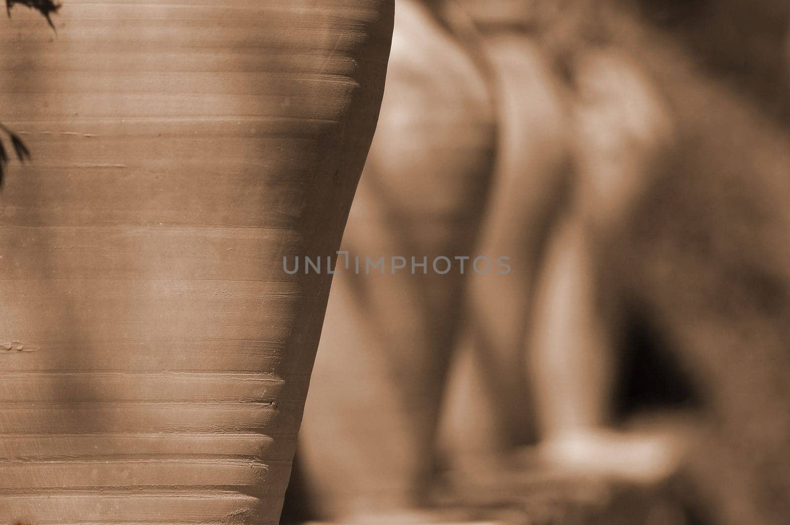 I saw these vases lined up on a wall along a path along the coast.