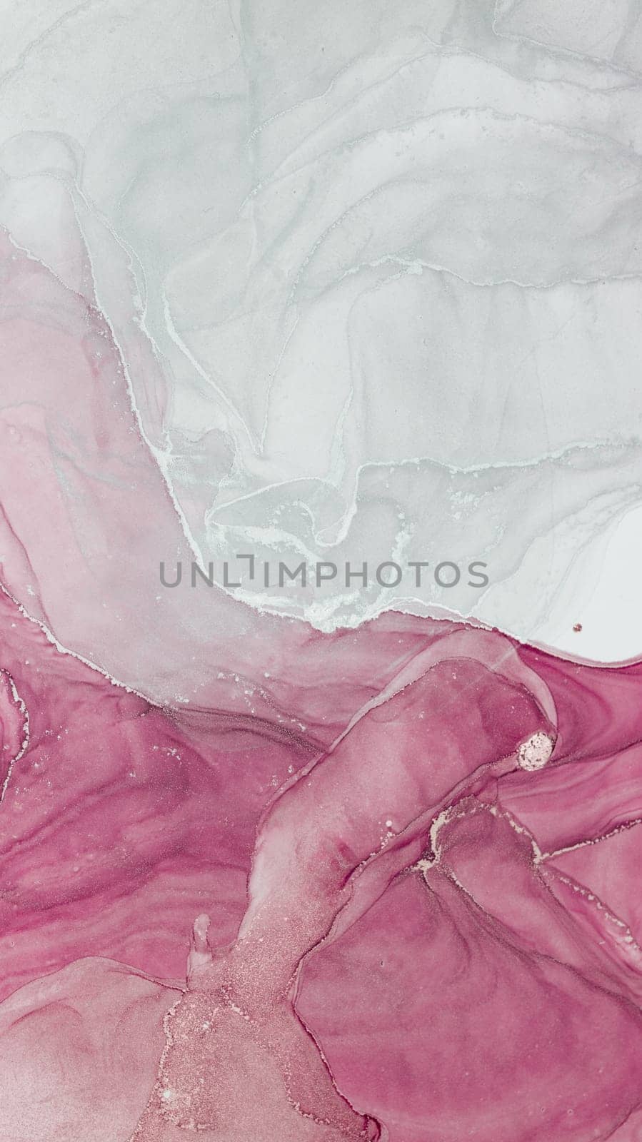 Swirls of alcohol ink create a delicate composition with soft pink and white hues blending seamlessly. The texture adds depth, evoking a calming and serene feeling in this abstract piece.