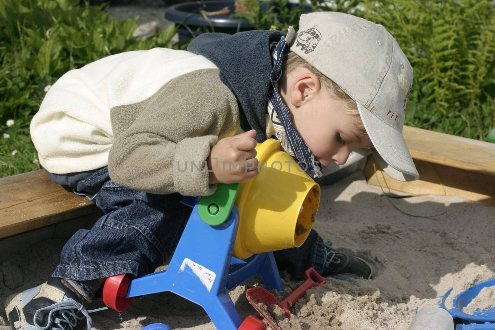 Boy playing in sandbox