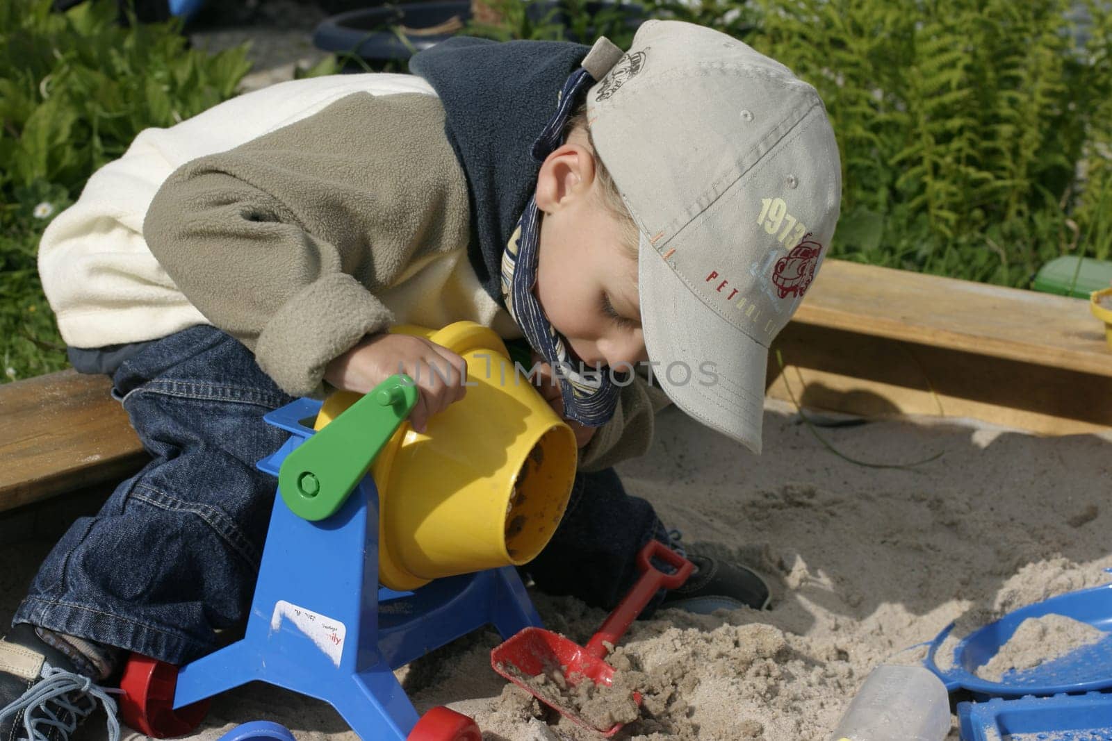 Boy playing in sandbox