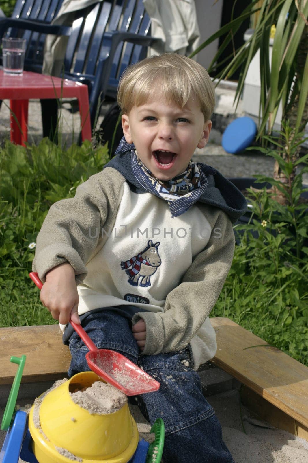 Boy playing in sandbox