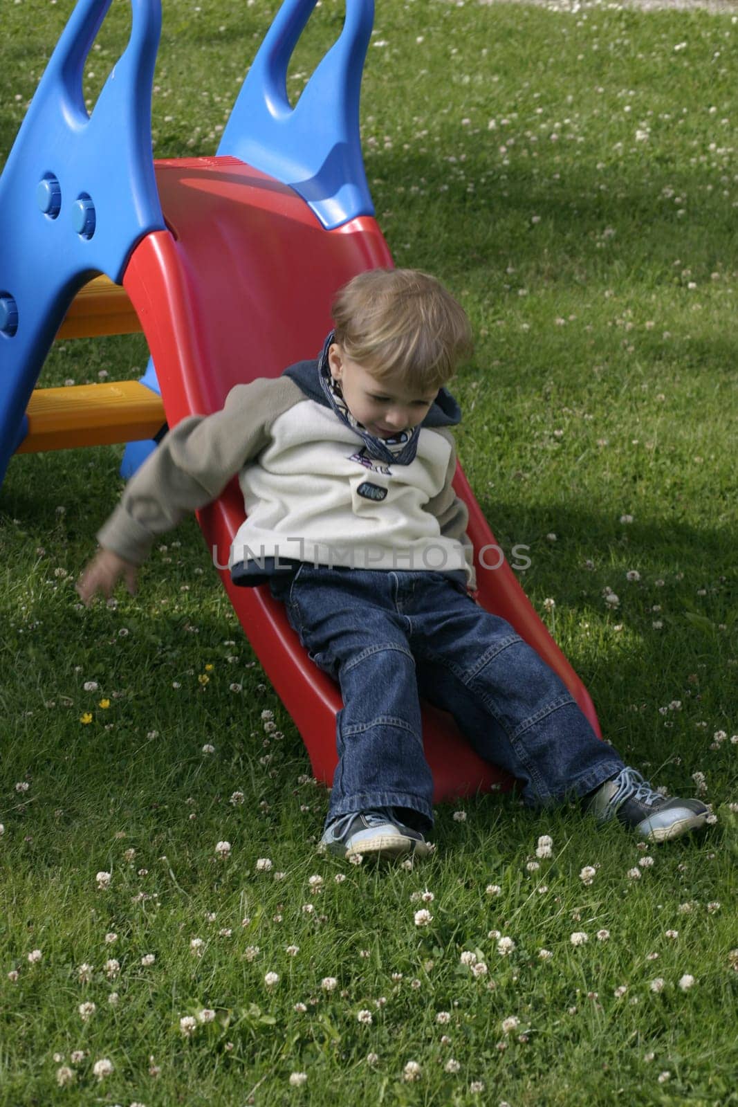 Boy playing with the slide