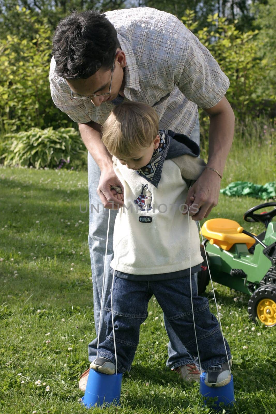 Father and son doing an exercise in skill