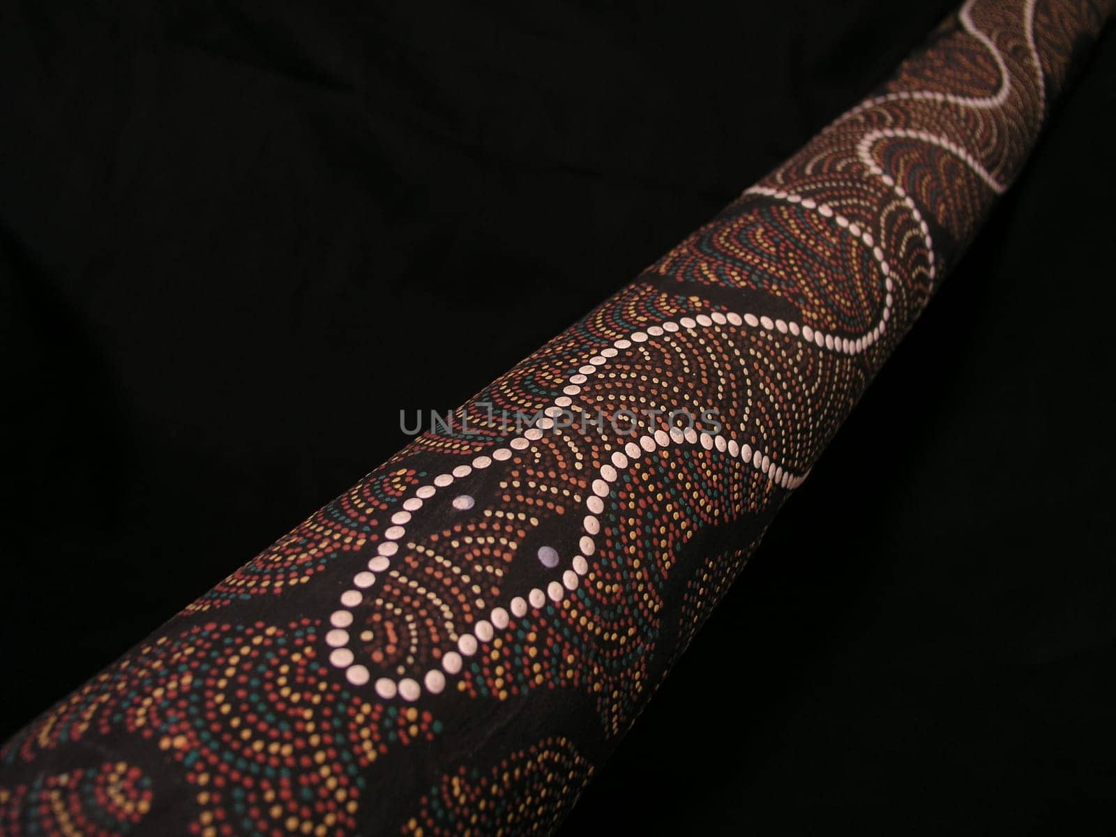 Rain again and no model nearby. Dot painting of the Australian aborigines on a didgeridoo.
