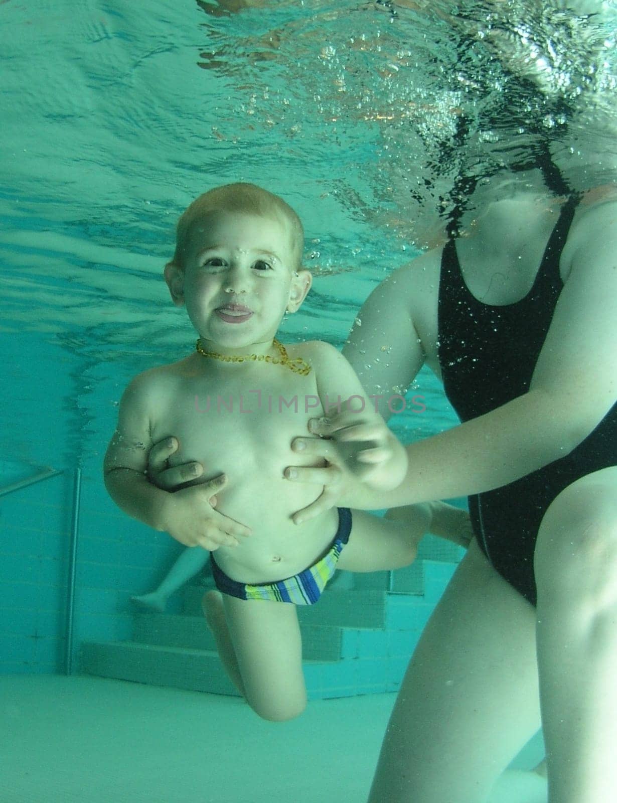 Created at my 1st baby swim shoot. The little one is a real "water rat"" and it was a pleasure to see how fun baby swimming is."