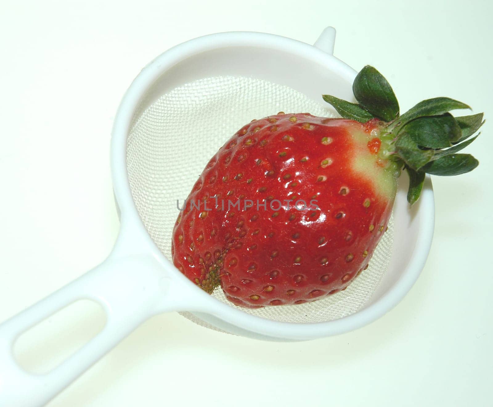Strawberry in a colander