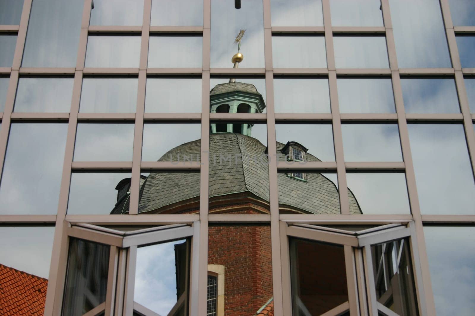 Reflection of a dome in a department store façade in Münster (Westphalia).