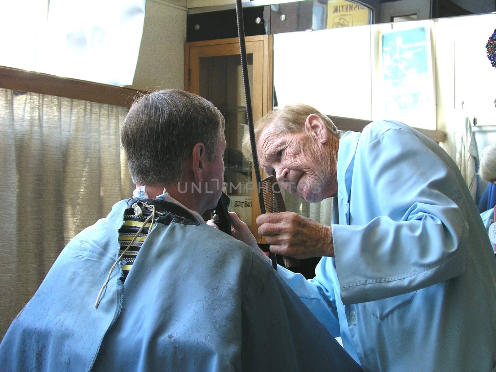 Kurt Ehleben.Probably the oldest,self-employed, master hairdressers who are still working  Schleswig-Holstein. He has been a master hairdresser since 1938 and has been self-employed for 55 years. He told me he was "29"" years old (92)."