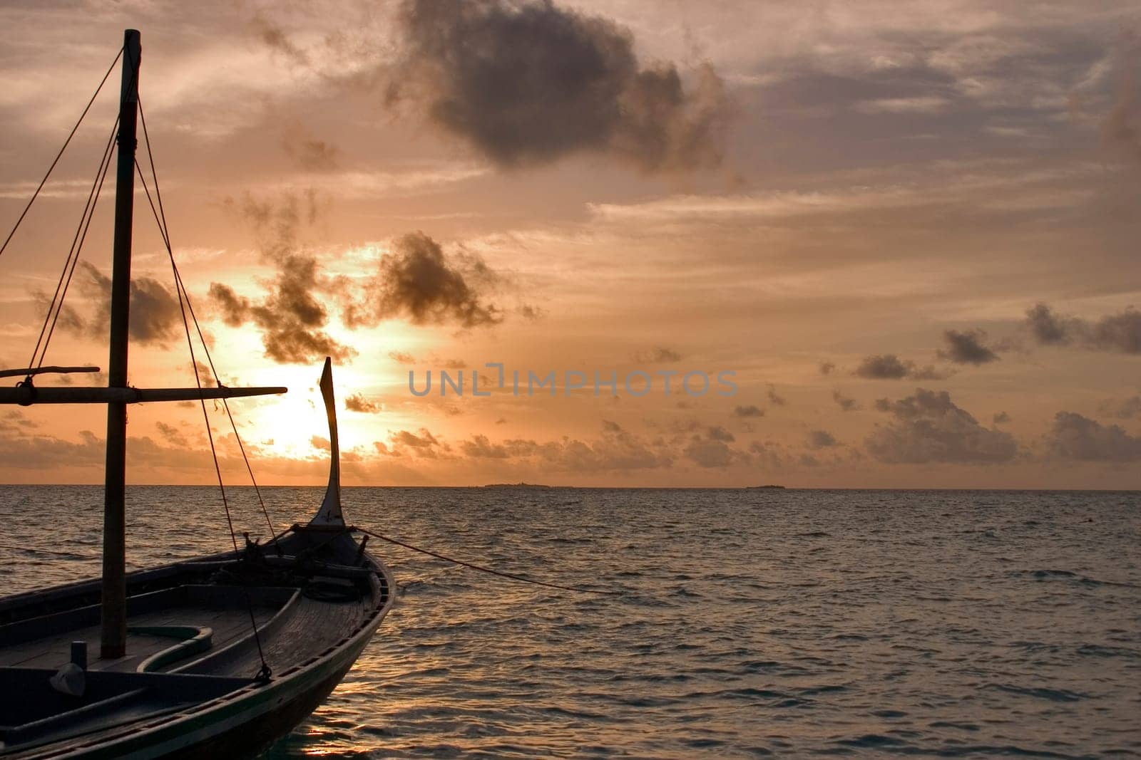 Dhoni at sunset,Maldives