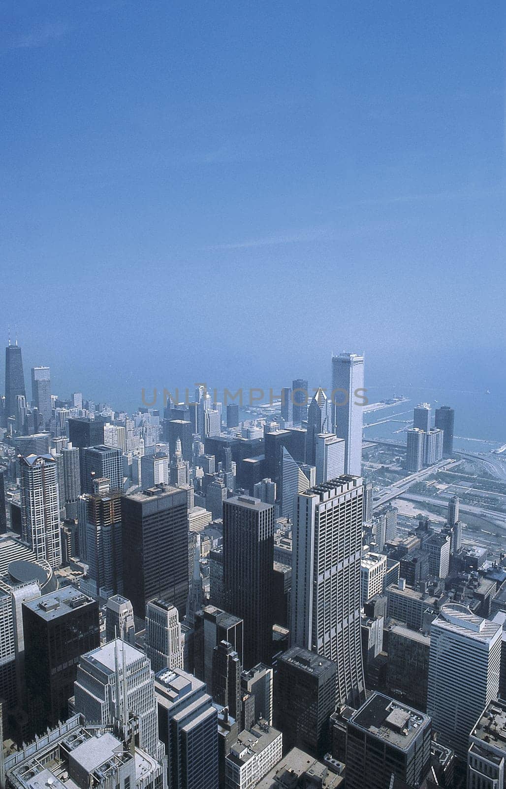 View of Chicago from the Sears Tower. There is still a lot of discussion about this title of tallest building,as the Petronas Towers include the tapered antennas,while the attached Sears Tower antenna does not count.