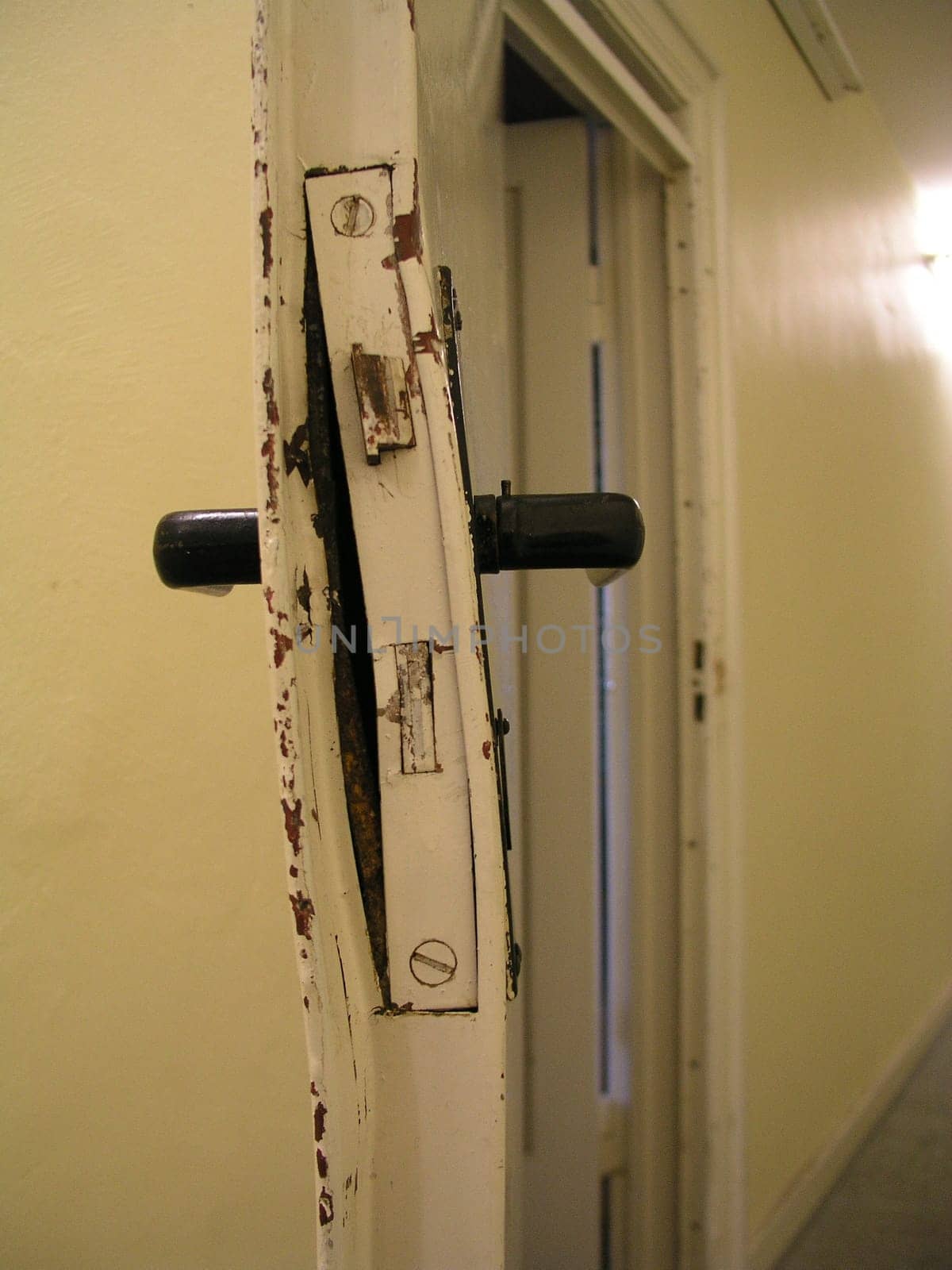 Broken door of a music practice room.