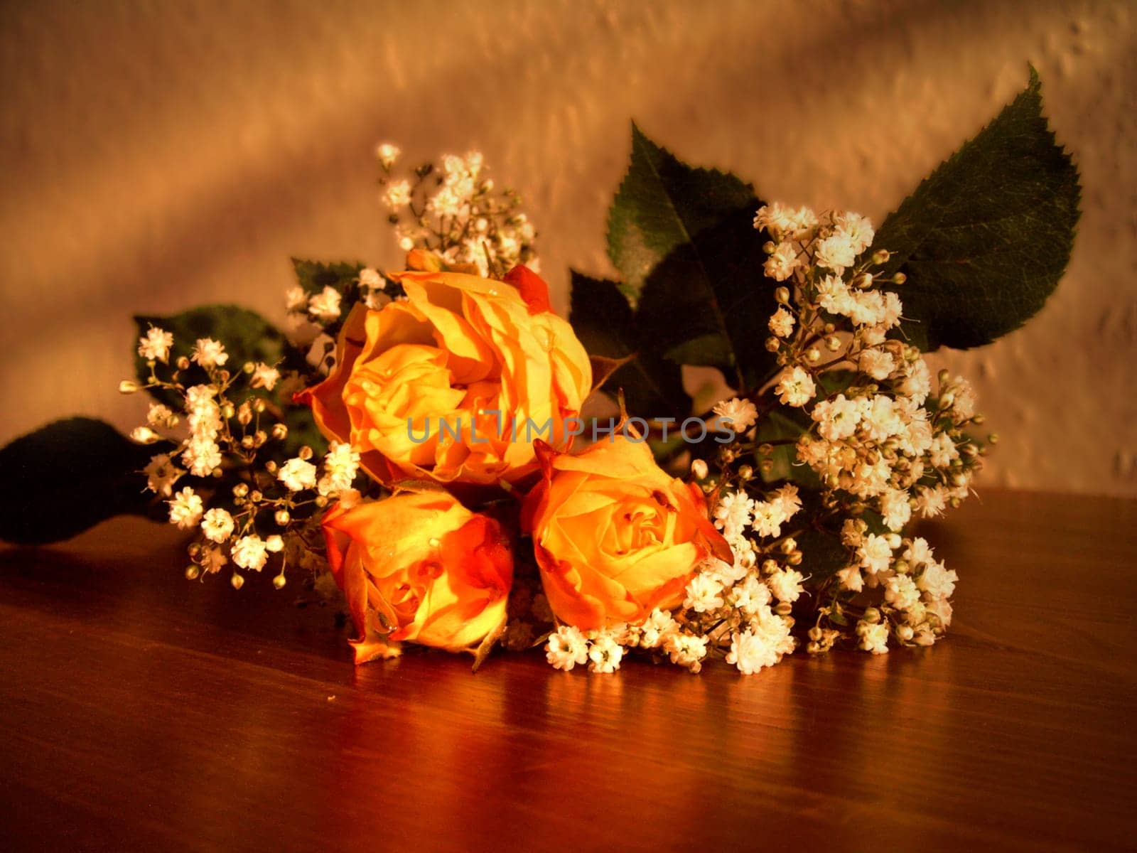 Bouquet of tea roses in the evening light