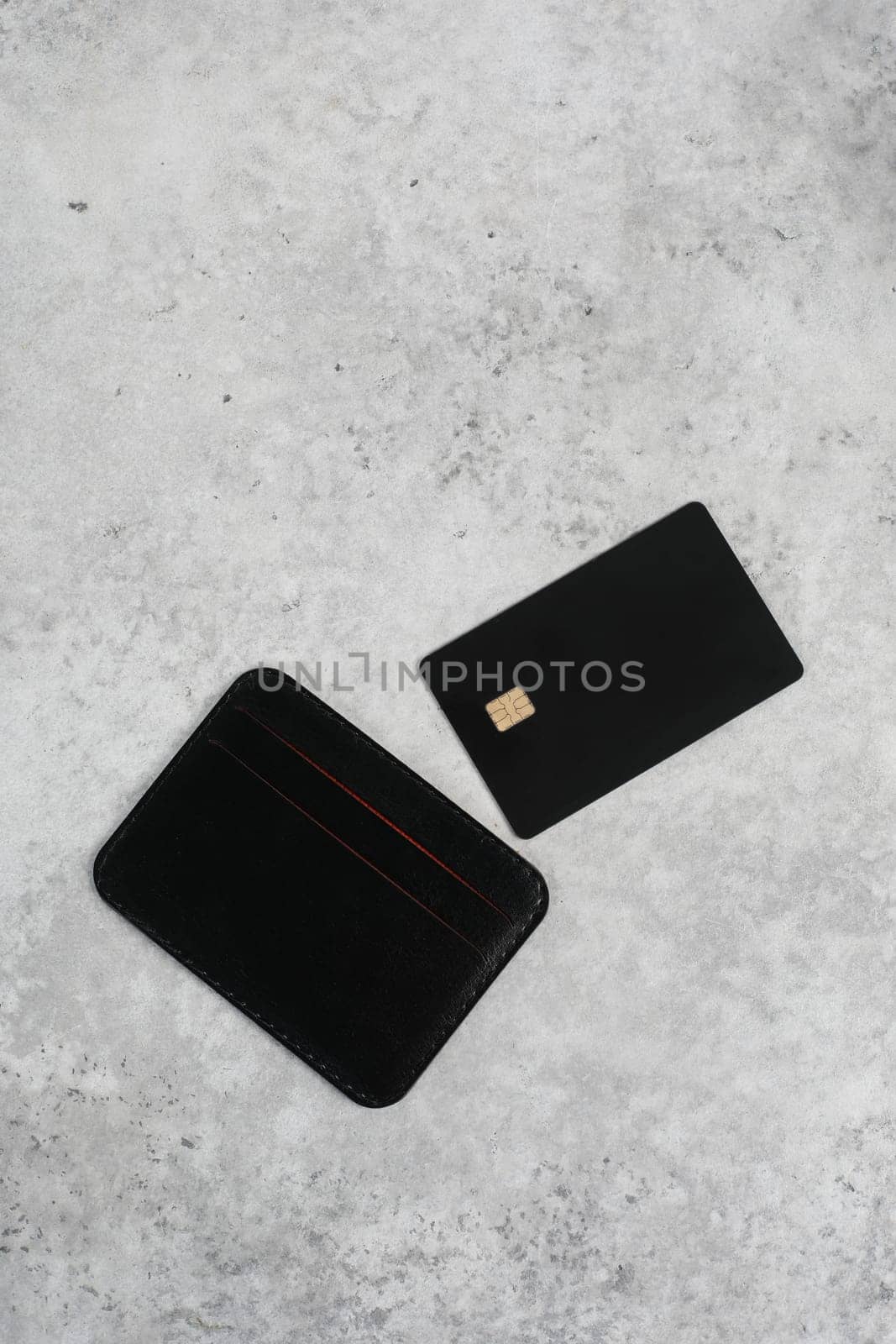 Black business leather card holder isolated on grey background. Logo design presentation.