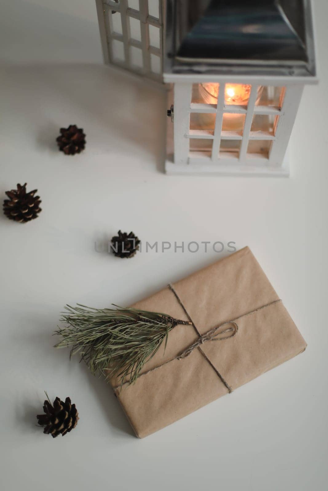 Christmas composition. Gifts, fir tree branches, decorations on white background. Christmas, winter, new year concept. Flat lay, top view, copy space by paralisart