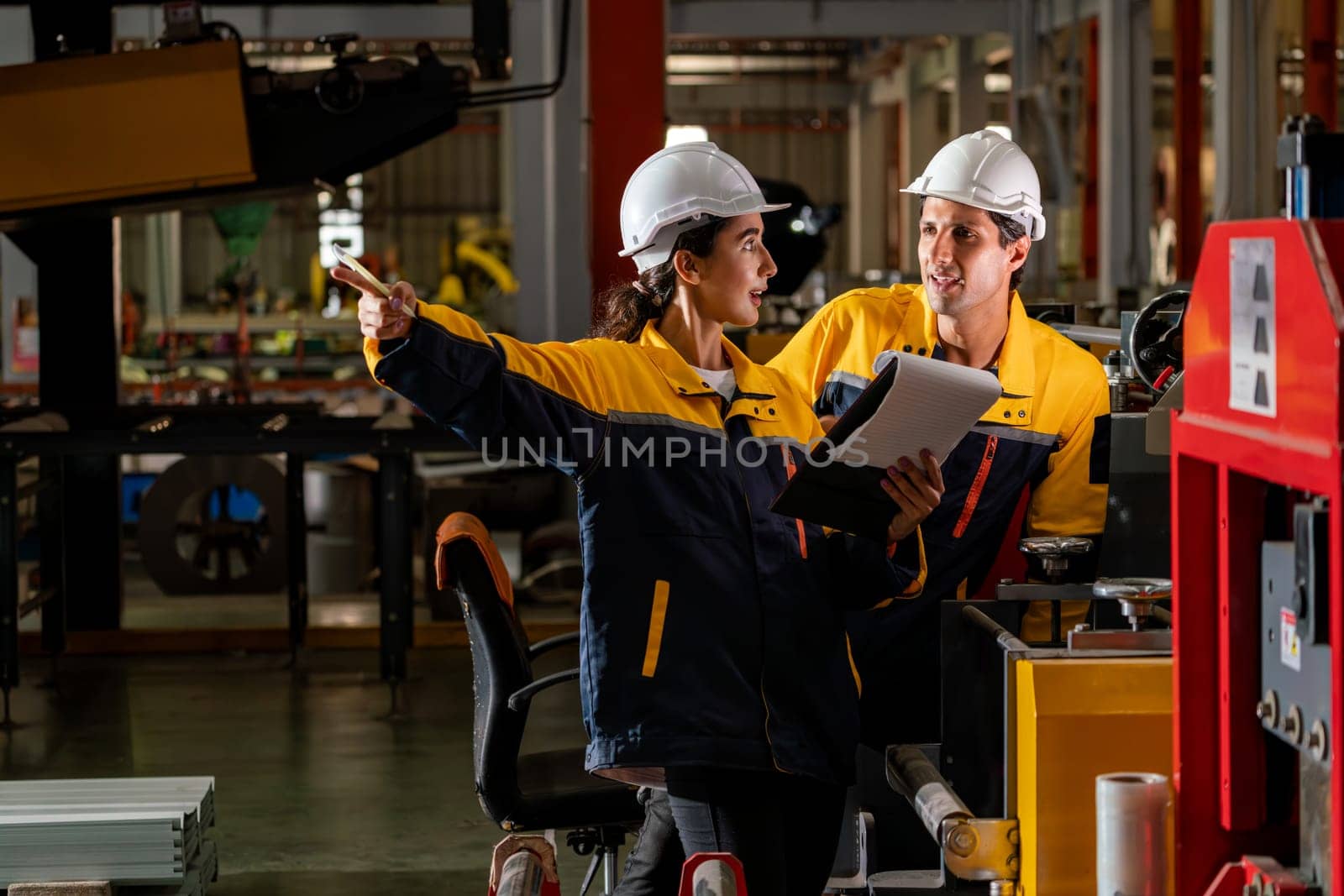 Professional quality control inspector conduct safety inspection on steel machinery and manufacturing process. Factory engineer or operator make optimization in heavy industry facility. Exemplifying